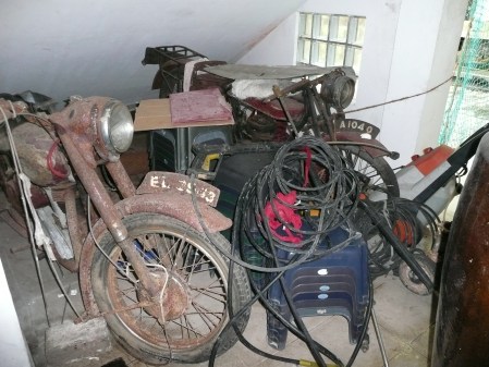 Mototcycles from each of the first two series in Ceylon.   A 1040 from the 1910-28 series and EL 3943 from the 1953-4 issue.   Seen in Colombo in 2009.   Brumby archive.