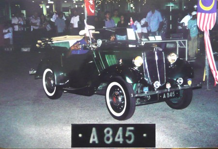 A - Perak state, on a 1935 Morris Eight tourer.