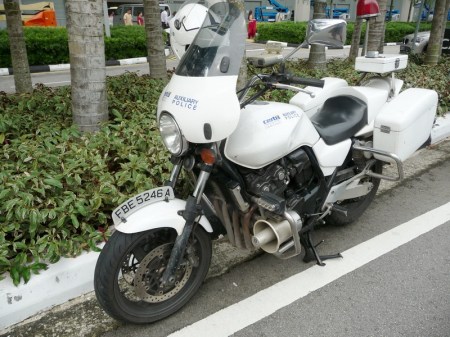 There is an auxiliary police orce,it seems, but they use normal private m/c plates. FBA 6232 B. Brumby archive.