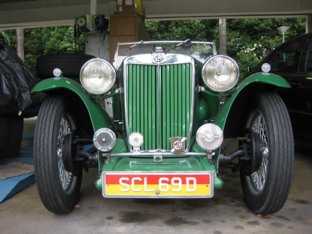 A well-restored MG TC sporting the special, low-tax plates of the approved vintage and veteran cars and bikes in Singapore. SCL 69 D is a normal registration issue, and it is the plate colour which gives the privileged status. Brumby archive.