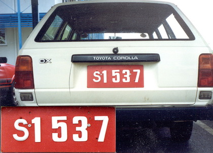 Government vehicles used the same series, but with a red background, repainted black when sold in to private use.    Brumby achive