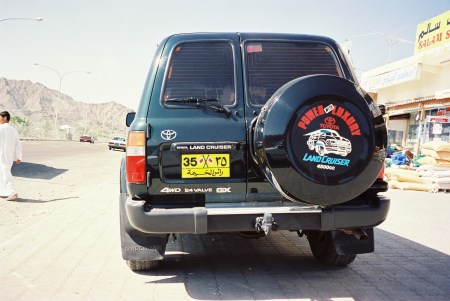A 1994 visit found so-called royal household cars all over the place and as they are picturesque, they probably justify another airing. Prince no. 35 stopping for a Coke and a diamond head-dress.