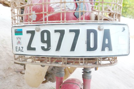 Motorcycle front plate in pressed alloy, for bikes which have somewhere to mount a long plate. Otherwise, they use an adhesive sticker plate.